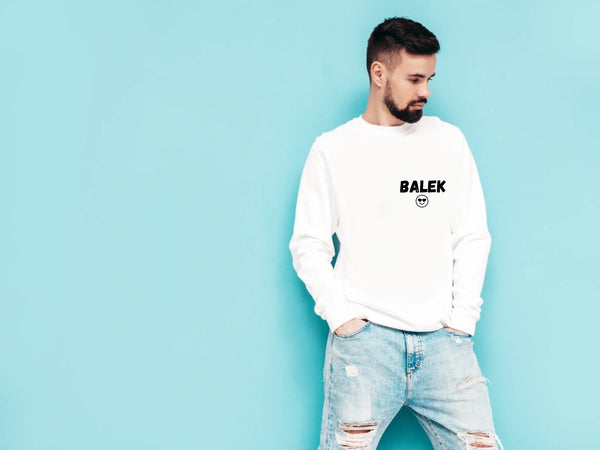 portrait-handsome-confident-stylish-hipster-lambersexual-modelman-dressed-white-sweater-jeans-fashion-male-isolated-blue-wall-studio