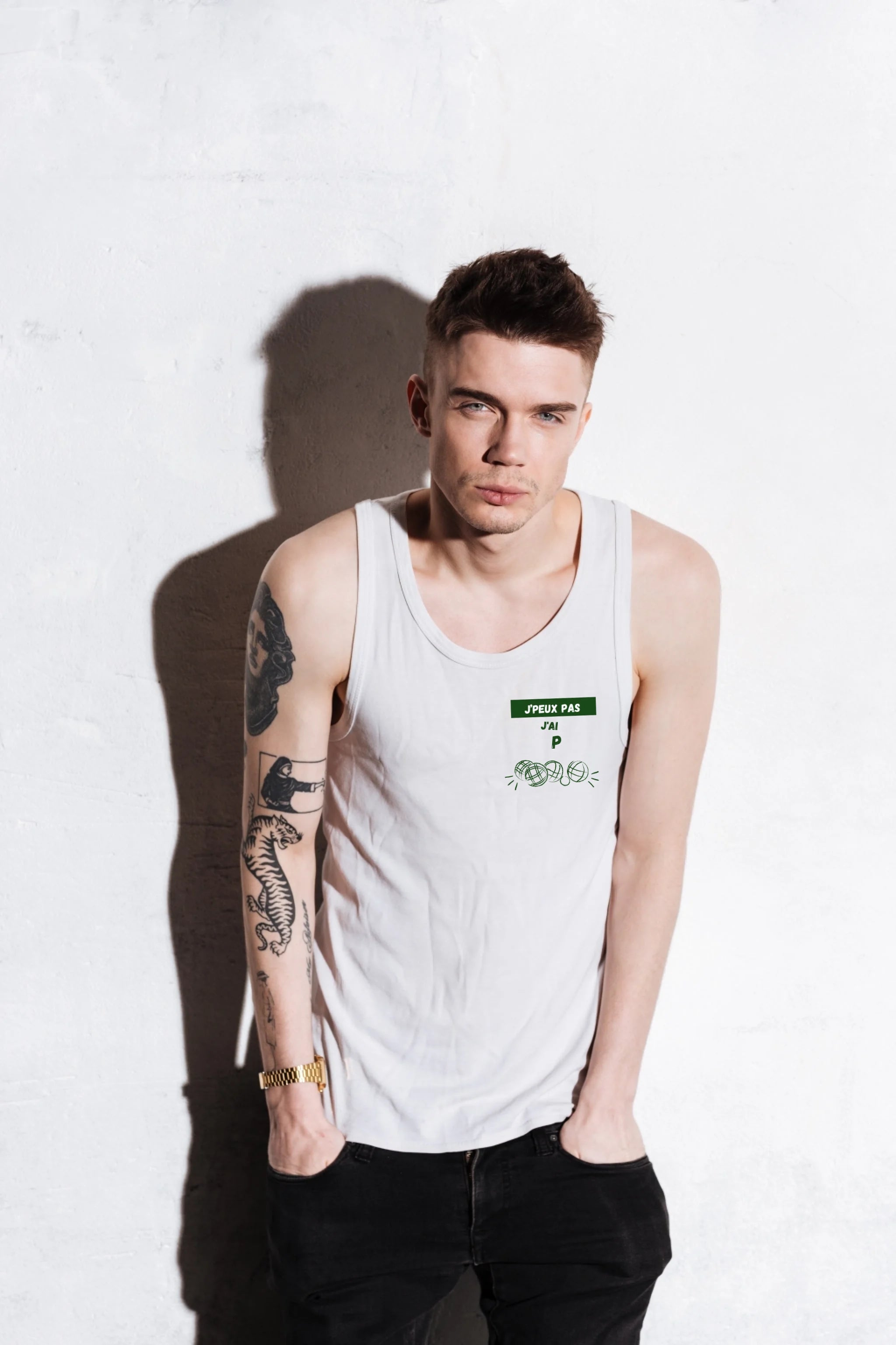 attractive-young-man-with-tattoo-his-hand-standing